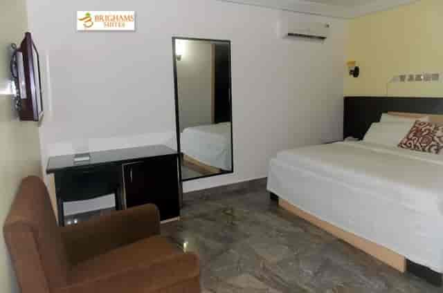 Budget-friendly Vatican room at Brighams Suites for business travel and corporate lodging.