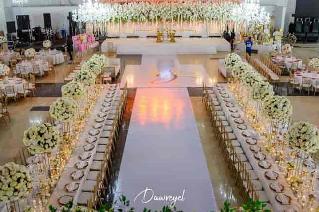 QueensPark Events Centre gala setup with white aisle and floral decor for formal event planning.