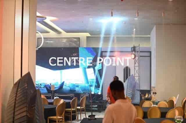 Modern event hall with LED wall and banquet seating for corporate showcases and galas.