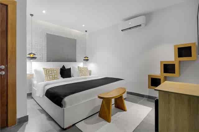 Modern minimalist hotel room at Villa 24, ideal for corporate travel and business stays.