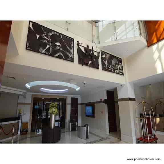 Hotel reception desk for event registration and corporate check-in at Pearlwort Hotel & Suites.