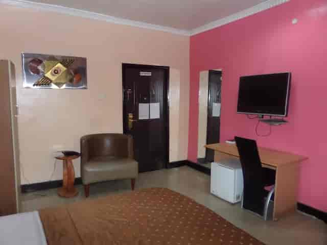 Budget guest room at Nest Lagos with compact workstation, ideal for affordable business travel.