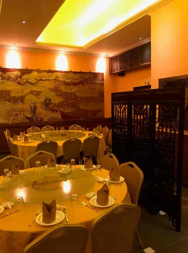 Zen Garden banquet hall with round tables for intimate corporate lunch or group dining events.