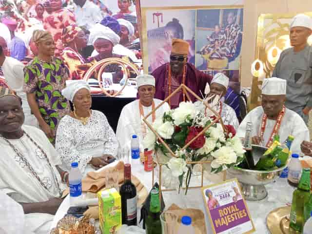 Nikkah banquet at Ronnie Dee Events Centre with structured floral centerpiece and VIP seating.
