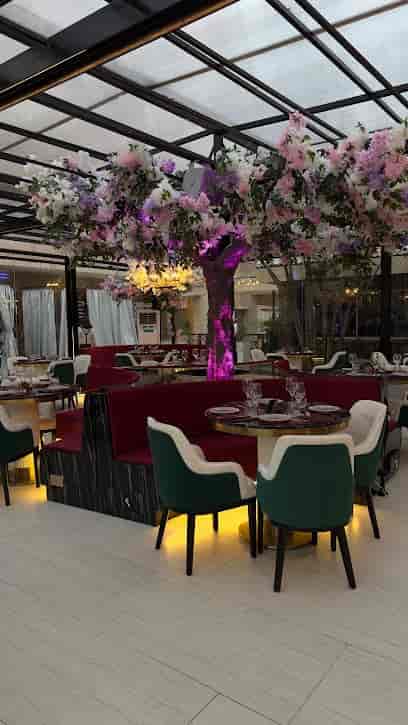 Euphoria dining area with LED trees for upscale reception and experiential dinner events.