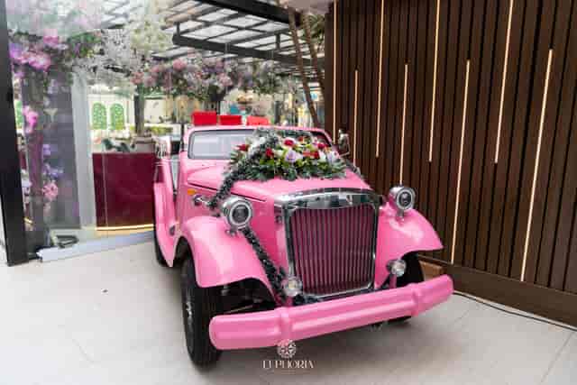 Vintage pink roadster prop at Euphoria restaurant for event branding and photography.