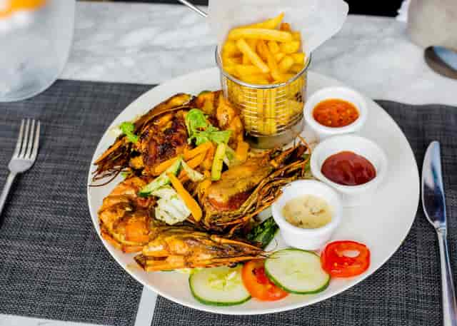 Grilled prawn entree at The Loft Ikoyi, upscale casual banquet dining and event catering.
