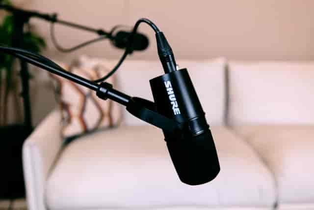 Podcast studio with premium microphone and sleek design for engaging audio events.