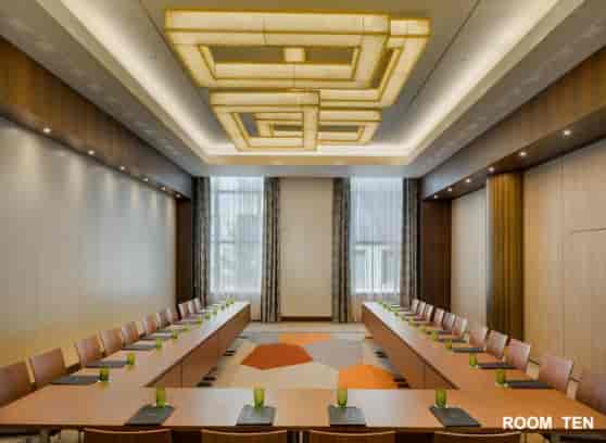 U-shaped conference setup in Kempinski Corvinus Budapest boardroom for luxury corporate meetings.