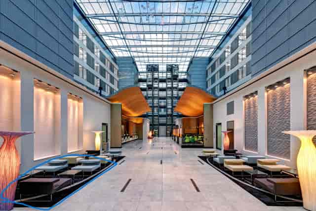 Hilton Frankfurt Airport atrium, modern seating for premium networking and corporate events.