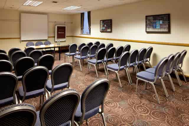 The Broker Suite, Mercure Glasgow: theater-style meeting room setup for corporate events.