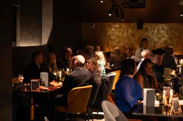 Lively restaurant The Mezz in AO Arena, perfect for networking and dinner parties.