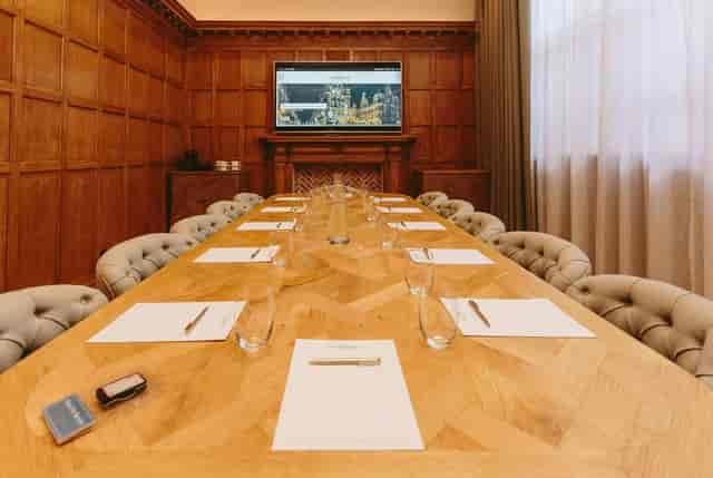 The Boardroom at The Scotsman Hotel with tufted seating for executive meetings and presentations.