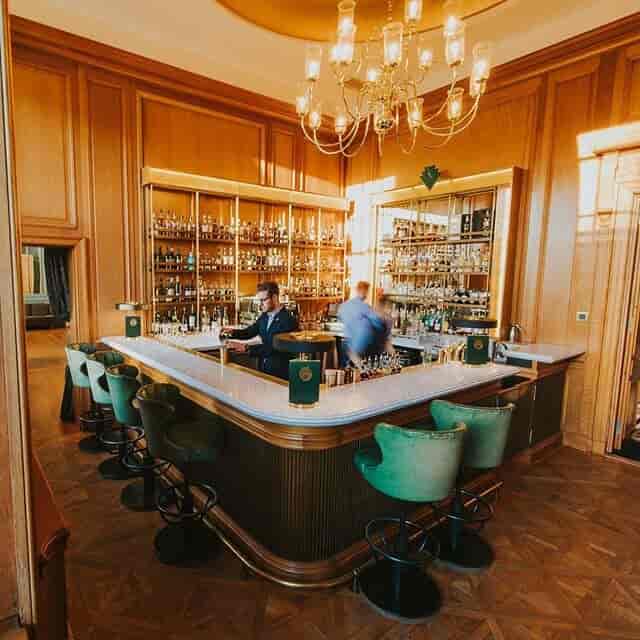 Games Room with velvet stools: upscale corporate networking and professional cocktail venue.