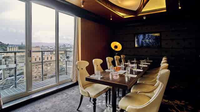 Upscale private dining room with city views for executive meetings and corporate events.