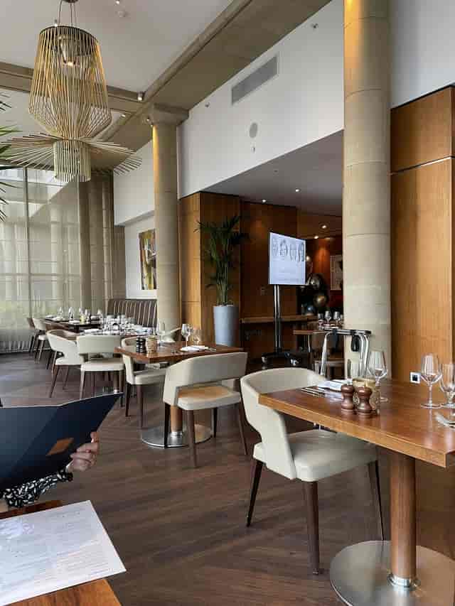Upscale restaurant with polished tables for corporate lunches and small group events.