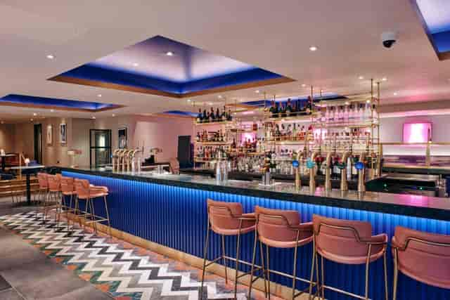 Modern LED terrace bar at Le Monde Hotel for evening networking and corporate cocktail receptions.