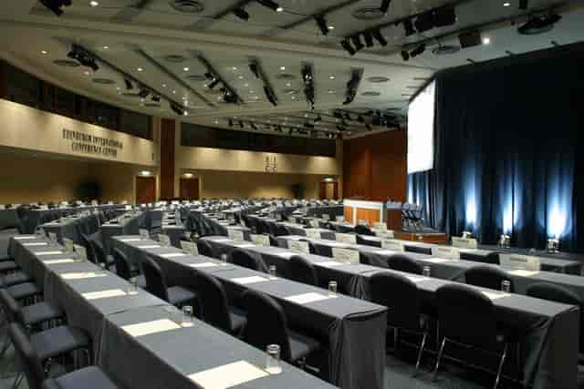 Classroom-style Quincentenary Conference Centre with professional stage lighting for plenary events.