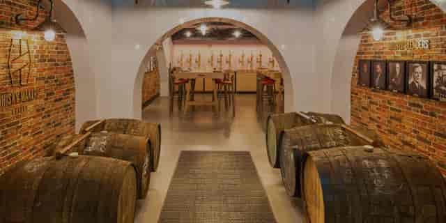 Whisky Makers' Cellar: Atmospheric VIP tasting room for exclusive corporate events.