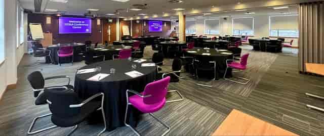 Modern banquet-style meeting space at COSLA Conference Centre for corporate events and breakouts.