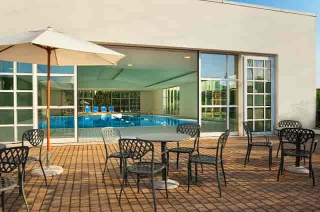 Banquet hall with poolside access at Hilton Rome Airport for corporate events and networking.