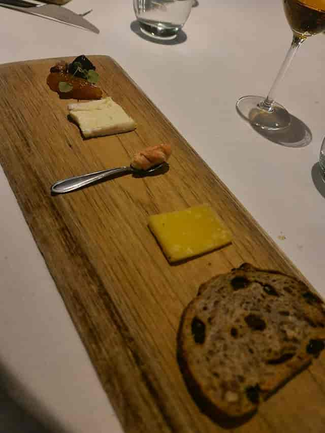 Minimalist plated starter at De Harmonie convention center, VIP dinner networking event.
