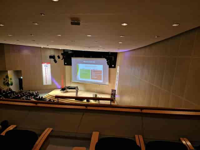 Eduard Flipse Zaal auditorium stage setup for corporate event presentation.