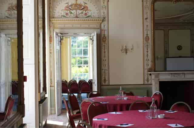 Kingston Maurward banquet room with ornate details for upscale conferences and boardroom meetings.