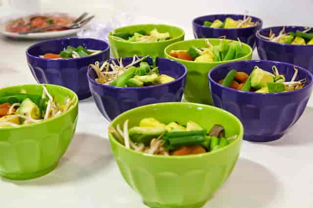 Grab-and-go bowls for rapid catering service: healthy, colorful pre-portioned F&B food station.