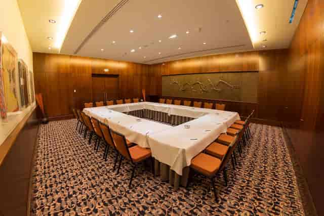 Clubhouse boardroom with wood panels, perfect for executive meetings and corporate events.