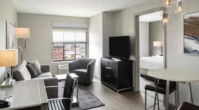 Residence Inn Portsmouth executive suite with dedicated workspace for business meetings and events.