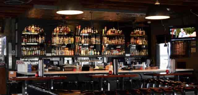 Gibson Street Bar with premium back-bar and booth seating for cocktail receptions or networking.
