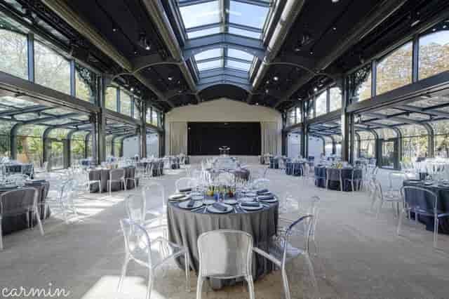 Pavillon Gabriel banquet hall with stage, ideal for luxury gala dinners and corporate events.