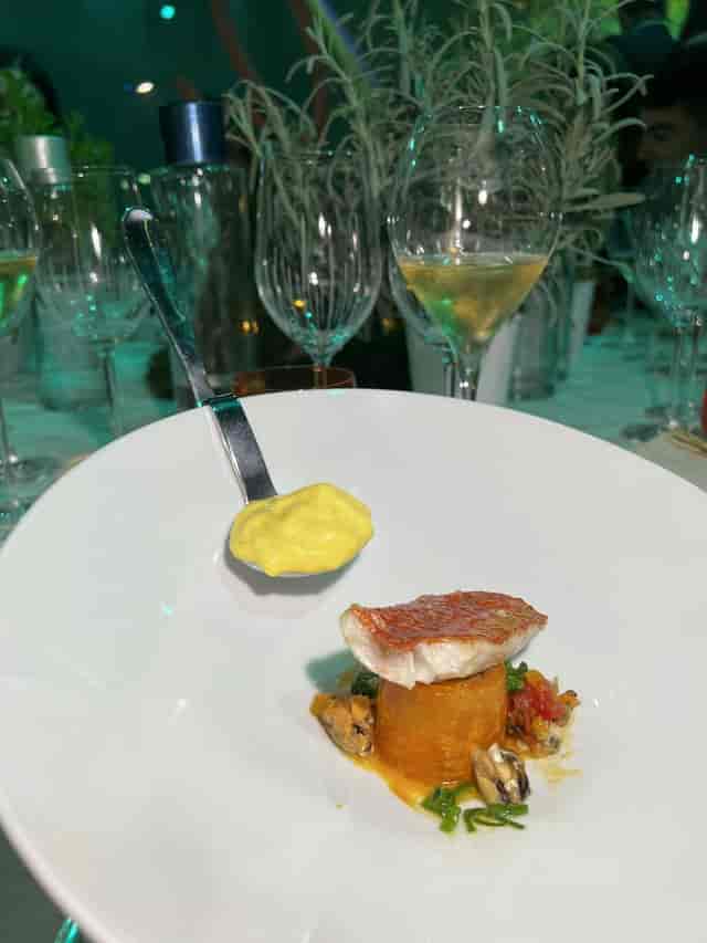 Plated entrée at Pavillon Gabriel gala dinner, elegant tabletop styling.