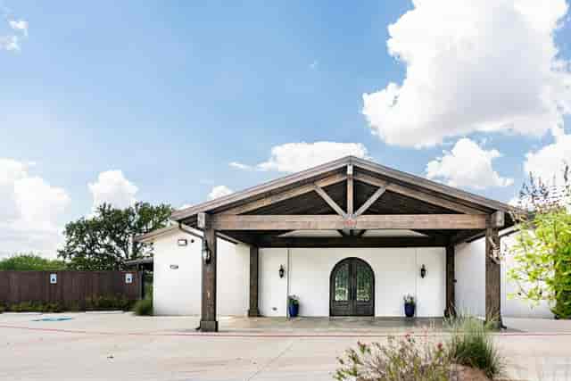 Rustic-chic James Event Center courtyard with porte-cochère for VIP arrivals and micro-events.