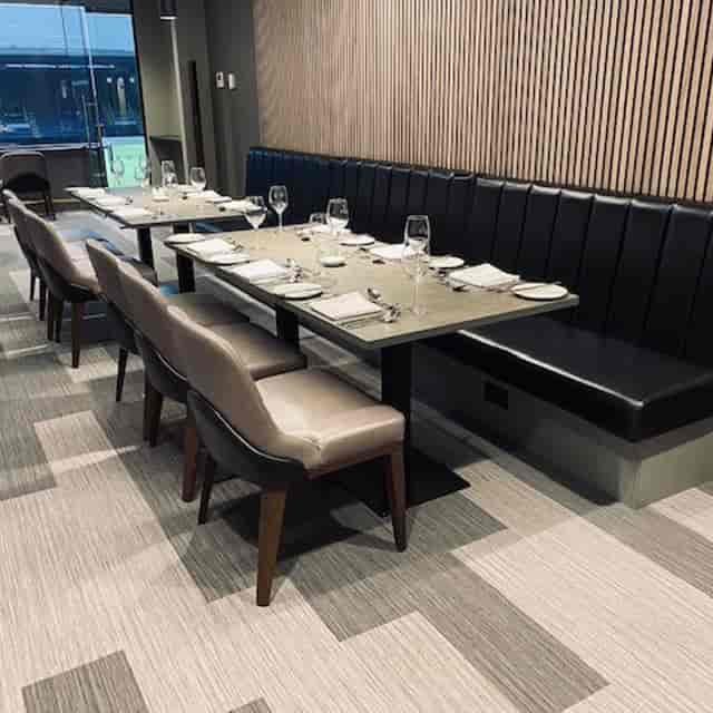 Burnley FC Directors Box: Modern VIP dining layout for corporate events and football networking.