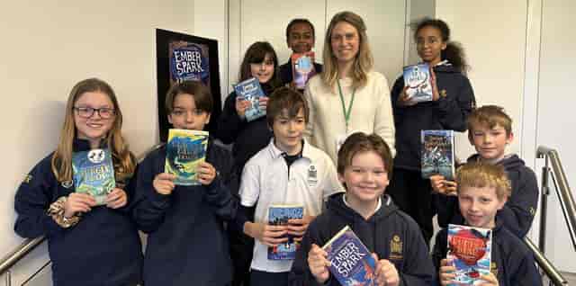 Author meet-and-greet at PACE school activation with engaged attendees and event branding.