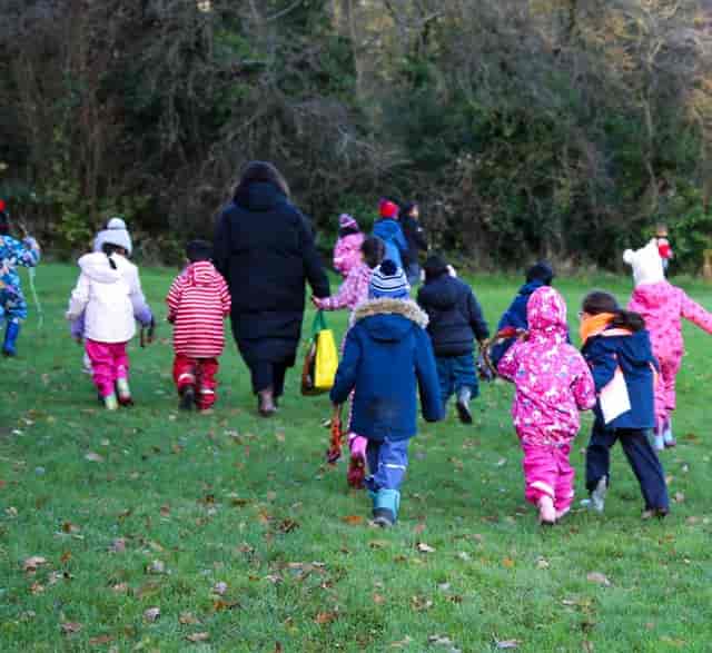 PACE group outdoor site visit: chaperones supervising children during a community field trip.