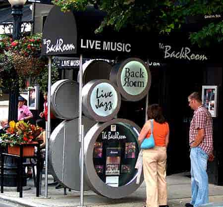 Live Jazz at Back Room Chicago: Intimate venue with branded circular signage and window displays.