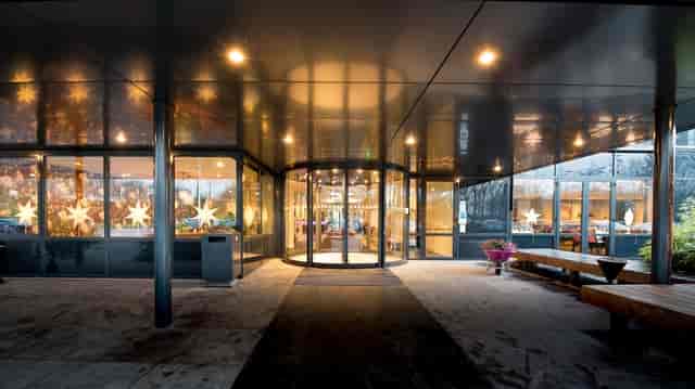 Modern hotel bar entrance for winter event branding and corporate holiday venue arrivals.
