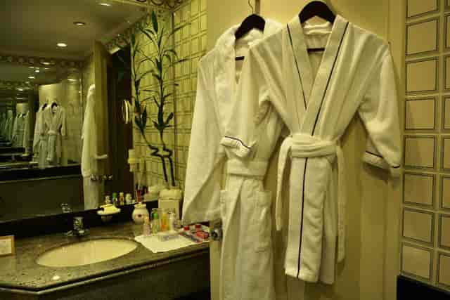 VIP room amenity setup with plush robes at Taj Mahal New Delhi for luxury event hosting.
