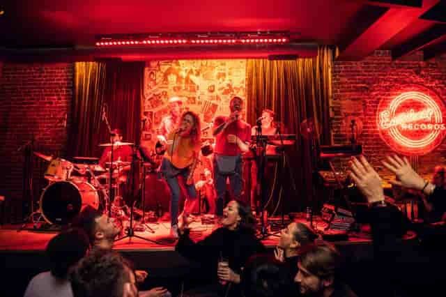 Vibrant live performance in Eastcheap Records' green room, ideal for social mixers.