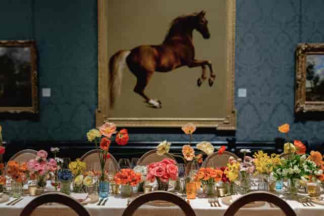 Elegant dining setup with floral decor in The National Gallery, perfect for upscale events.