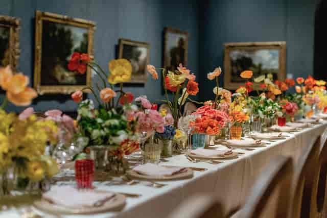 Elegant dining table with vibrant florals at The National Gallery event venue.