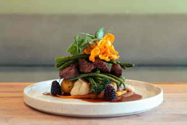 High-end banquet entrée at Hot Toddy whisky lounge for corporate events and luxury catering.