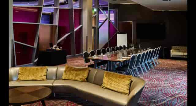 Modern boardroom with high-backed chairs for professional meetings and corporate events.