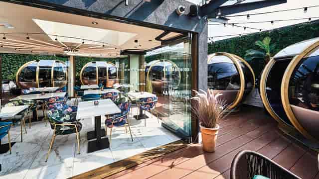 Sky Bar and Restaurant with spherical pods for corporate networking and private event hosting.