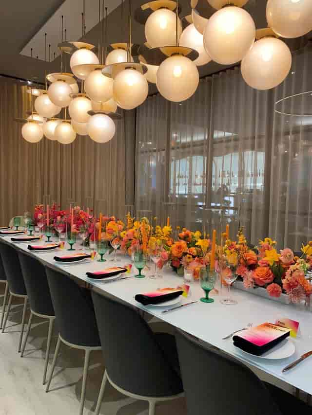 Sophisticated ZANA private dining room with floral runner for executive dinner or celebration.