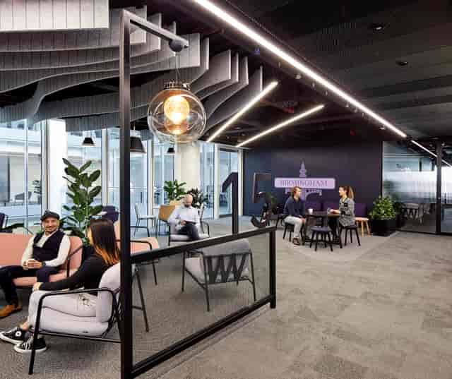 Modern corporate breakout space for flexible collaboration and office event planning.