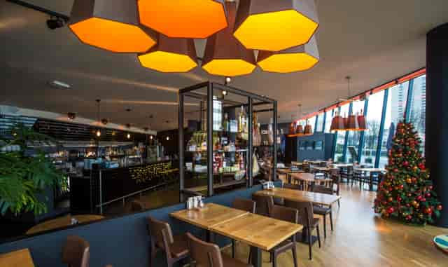 Modern wine bar with geometric lighting for corporate networking and business receptions.